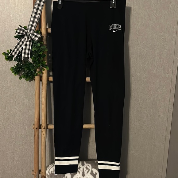 Nike Pants - Nike leggings black with white stripe detail. Size M